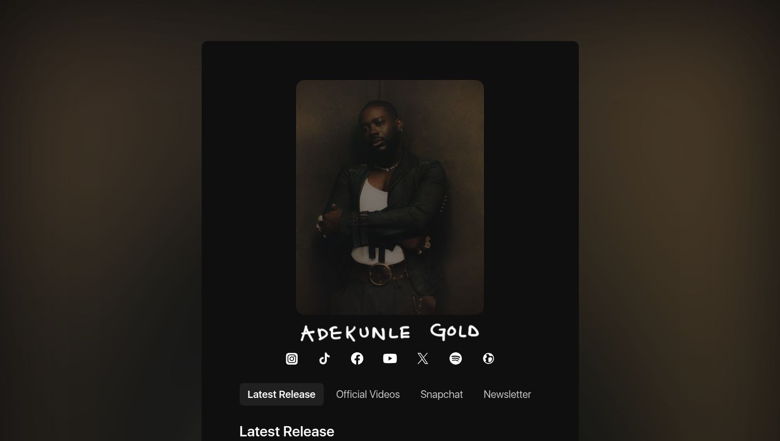 Adekunle Gold's official Komi.io artist page featuring his portrait, social media icons, and navigation links