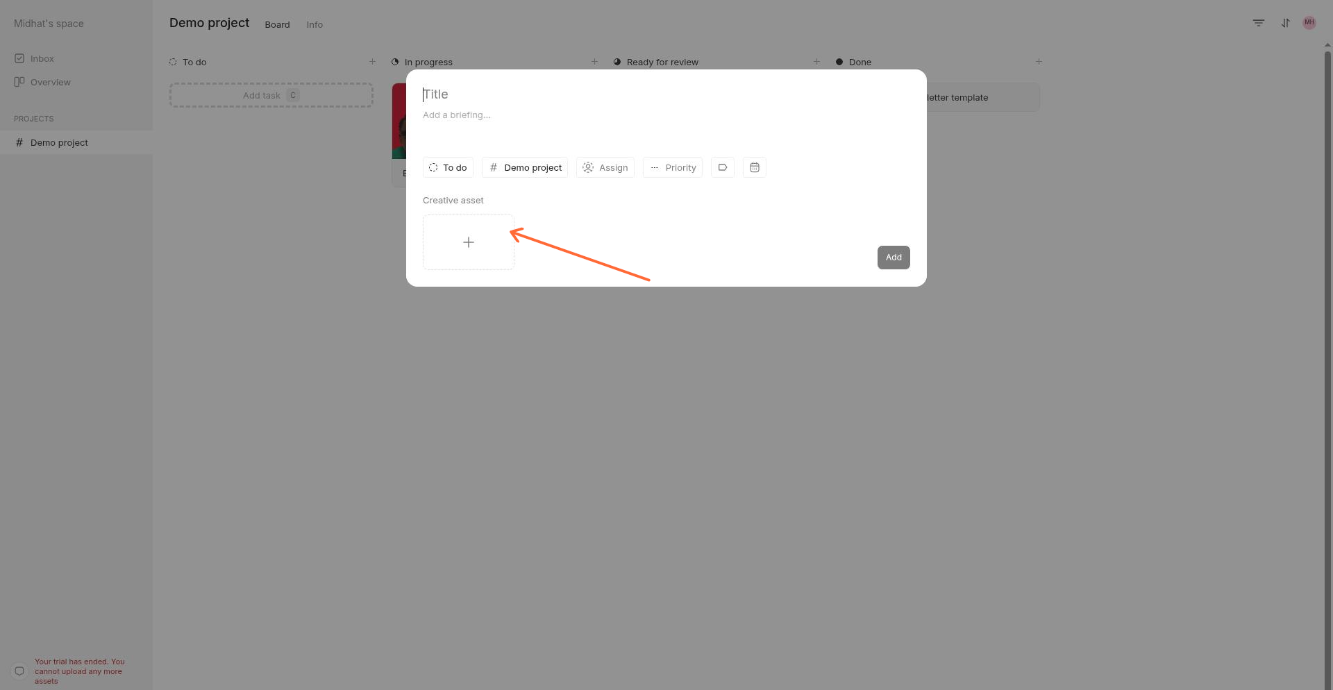 The upload area in the new task modal where you can drag and drop files or click Select.