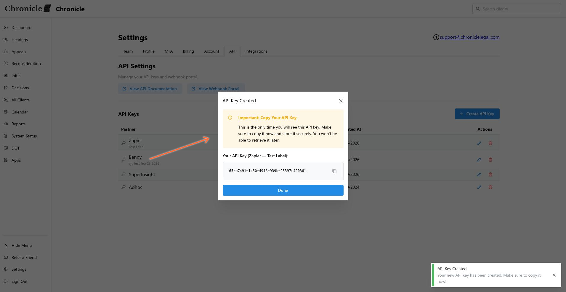 New API key displayed in a modal with a security warning