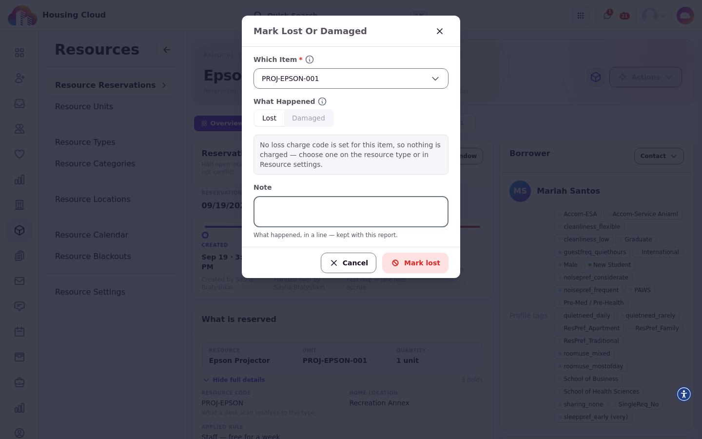 The Mark Lost Or Damaged dialog with the Which item picker, the Lost and Damaged choice, and the charge preview