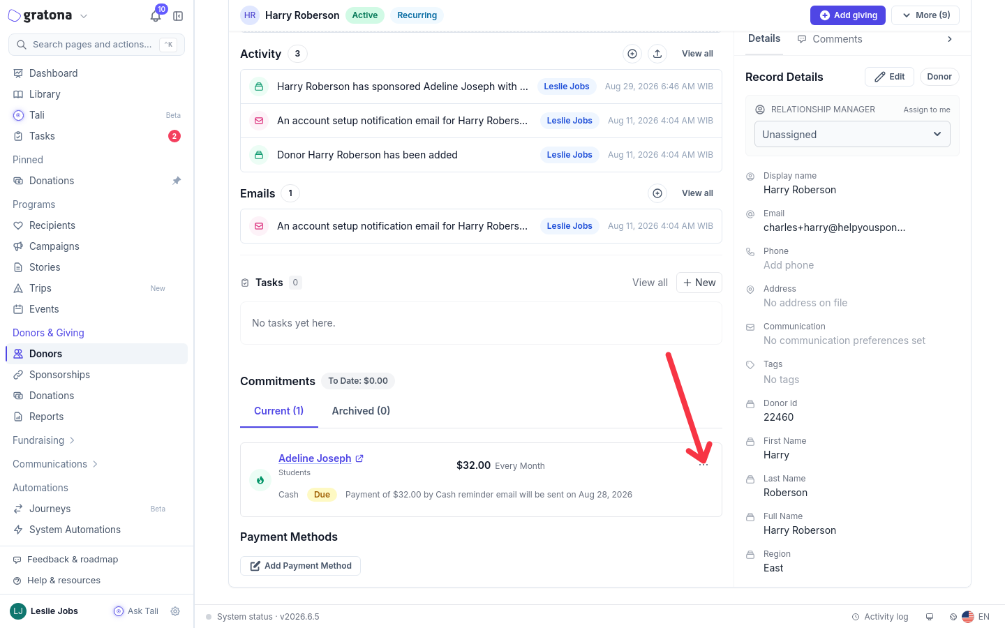 A donor profile with the Commitments section open on the Current tab, an arrow pointing to the three-dot actions menu on the sponsorship row